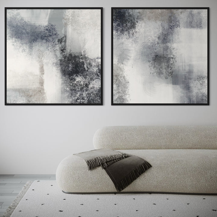 Minimalist Abstract Canvas Paintings With a Curved Off-White Boucle Sofa and Fringe Blanket in a Cozy Living Room.
