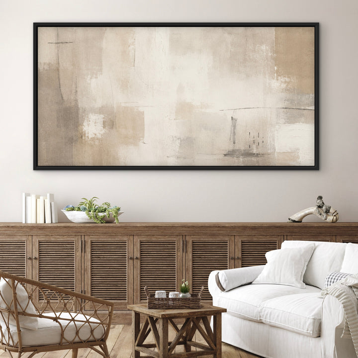 Soft Summer beige panoramic framed canvas above a rattan sideboard and white sofa