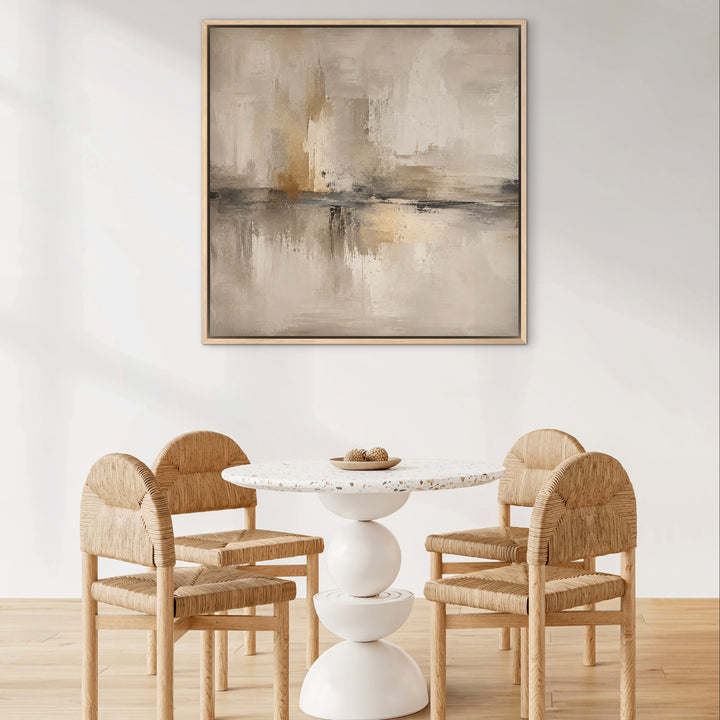 Como square canvas in a natural frame above a small dining table