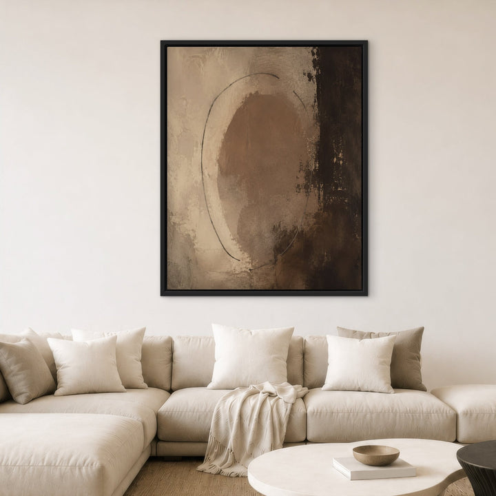 Chocolate Orbit brown abstract framed canvas above white sofa, black frame