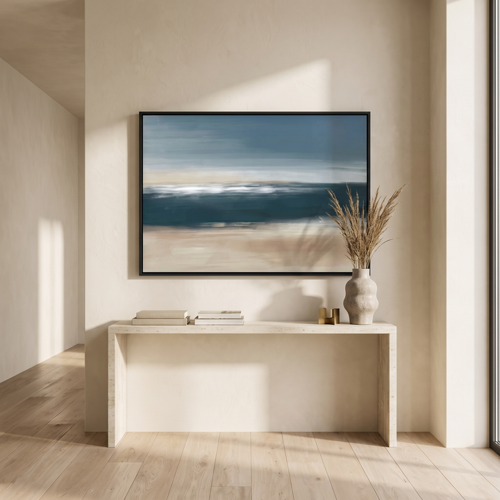 Coastal Whisper framed canvas in black frame above a travertine console table - teal, blue and beige abstract wall art