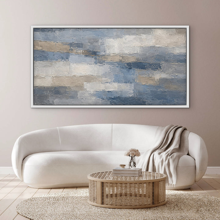 Denim Quarry blue grey panoramic abstract framed canvas above a curved cream sofa