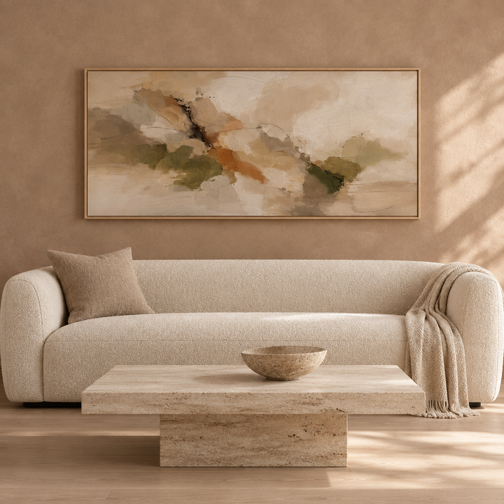 Amber Grove warm earth panoramic framed canvas in a natural oak frame above a cream boucle sofa