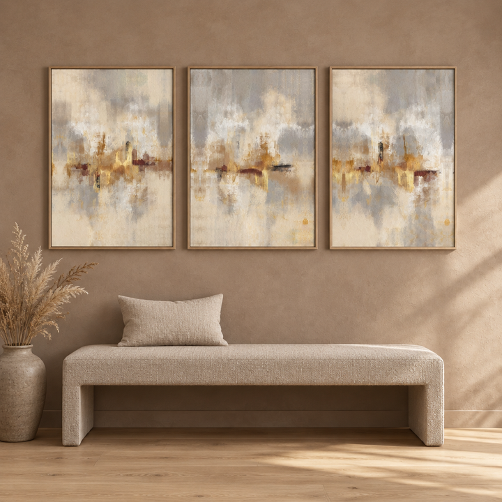 Gold Serenity set of three framed canvases in natural oak frames above an oatmeal linen bench