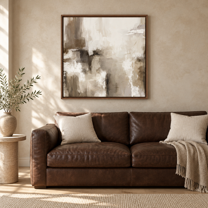 Santorini square abstract framed canvas in a brown wooden frame above a chocolate leather sofa