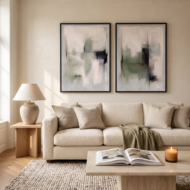 Tuscany Green set of 2 framed canvas in black frames above a cream boucle sofa - sage green and charcoal abstract wall art pair