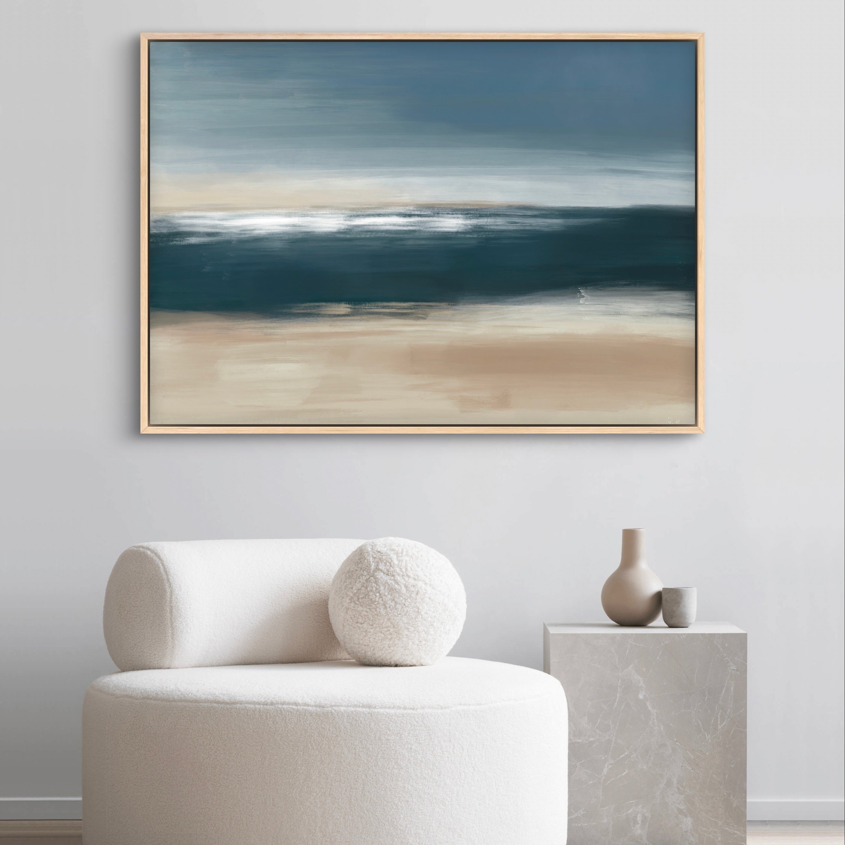 Modern Abstract Framed Canvas Art Styled with Cream Bouclé Lounge Chair with Round Pillow, Gray Marble Cube Side Table, and Decorative Accent. Perfect for Contemporary Reading Nook.