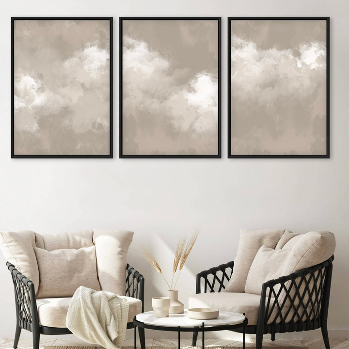 Modern Abstract Cloud Art, Framed Canvas With Cream Lounge Chairs, Black Woven Frames, And A Round Marble Coffee Table—Perfect For A  Minimalist Receiving Area.