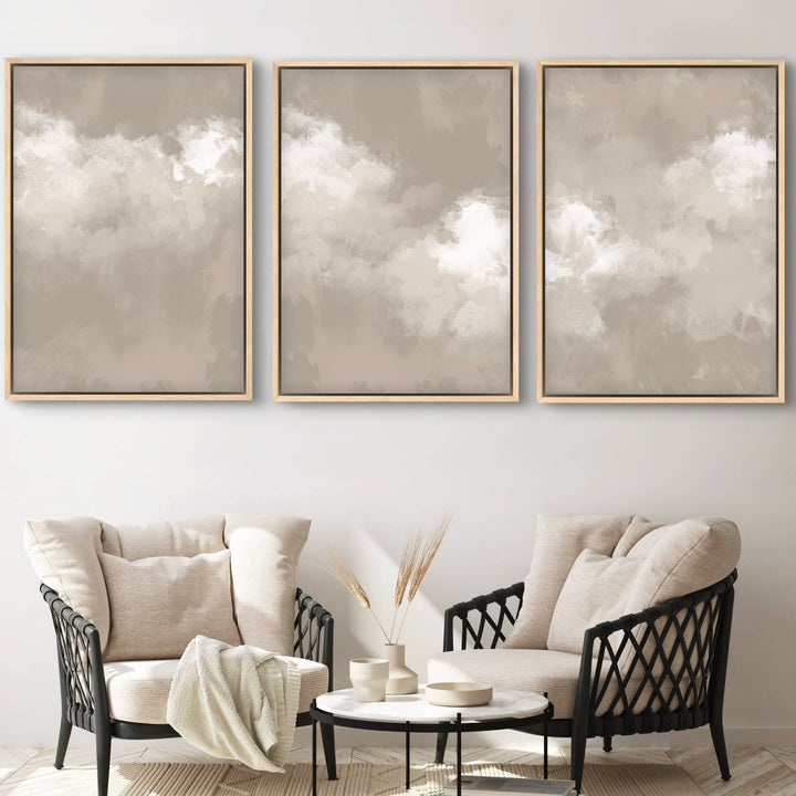 Modern Abstract Cloud Art, Framed Canvas Styled With Cream Lounge Chairs, Black Woven Frames, And A Round Marble Coffee Table—Perfect For A Serene Minimalist Living Room.