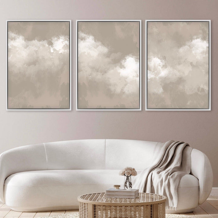 Modern Abstract Cloud Art, Framed Canvas Styled With A Curved White Sofa, Cozy Throw, And Rattan Round Coffee Table—Perfect For A Soft Neutral Living Room.