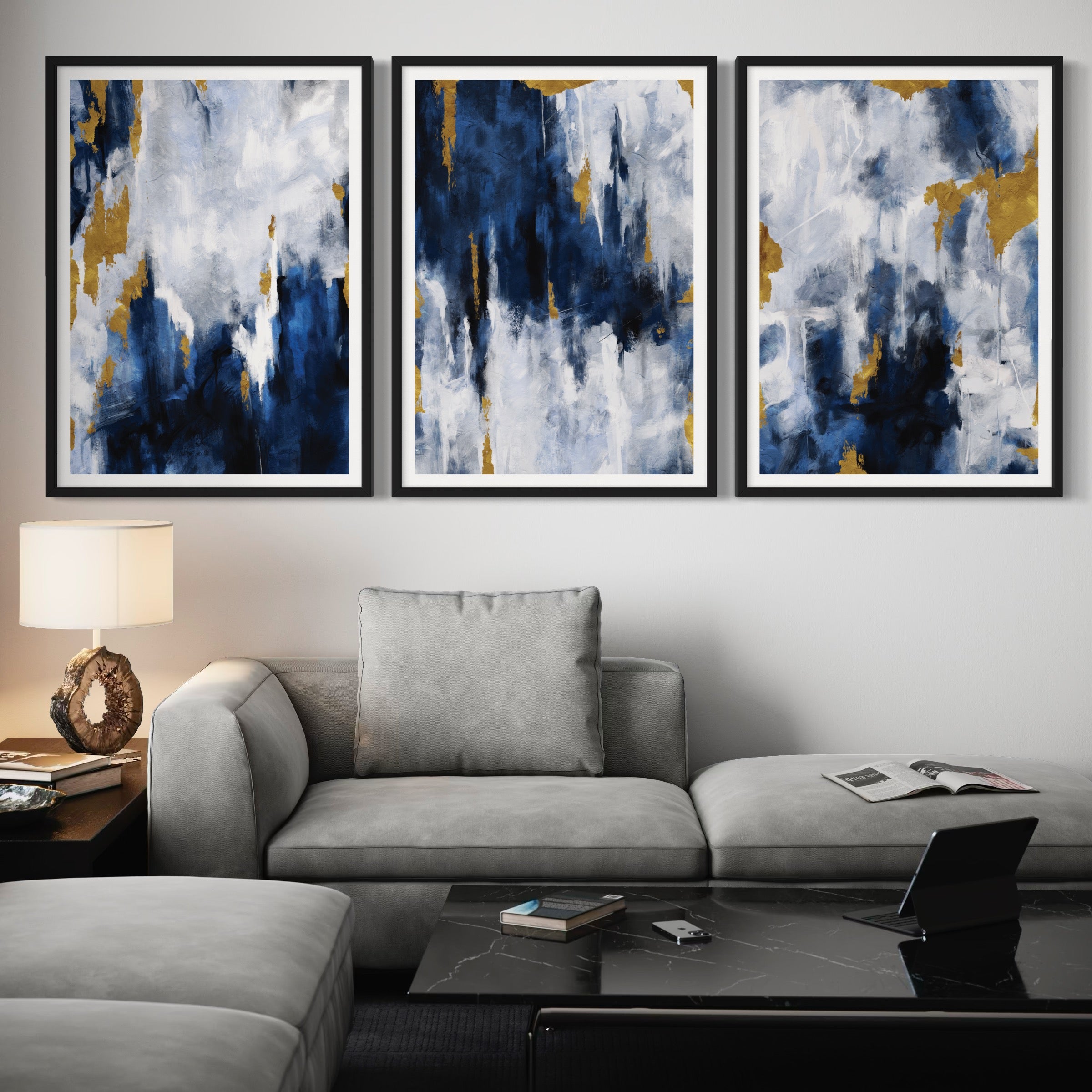 Modern Abstract  Art Styled With A Soft Grey Sectional, Black Marble Coffee Table, Warm Table Lamp, And Minimal Accents. Perfect For A Minimalist Living Room.