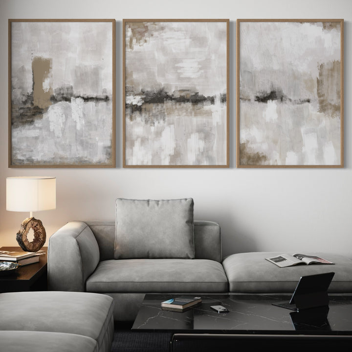 Modern Abstract Art Styled With A Soft Grey Sectional, Black Marble Coffee Table, Warm Table Lamp, And Minimal Accents. Perfect For A Minimalist Living Room.