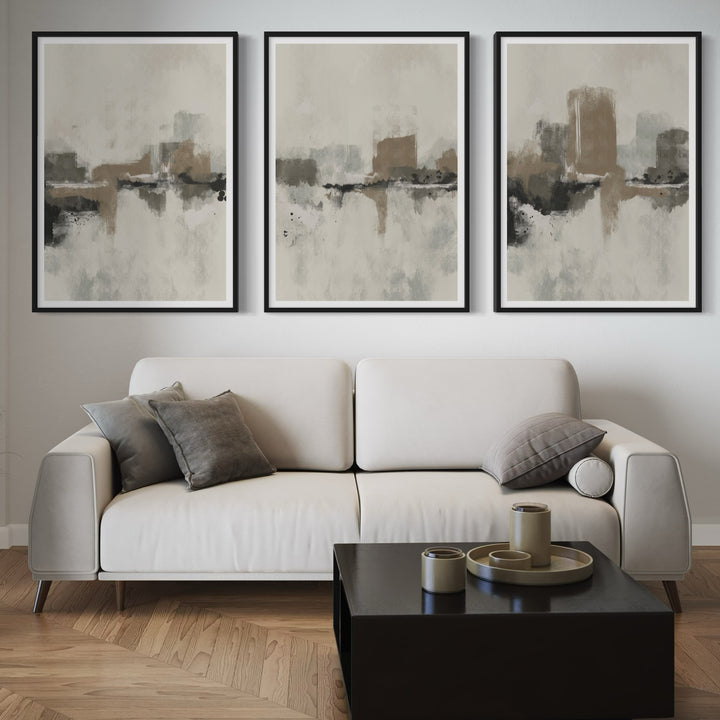 Elegant Abstract Wall Art Styled With A Light Cream Sofa, Black Square Coffee Table, Grey Accent Pillows, And Wood Floors. Perfect For A Minimalist Living Room.