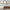 Set of 3 Neutral Abstract Framed Canvas Wall Art Prints Above Mid-Century Wood Sideboard with Decorative Accents and Upholstered Bench