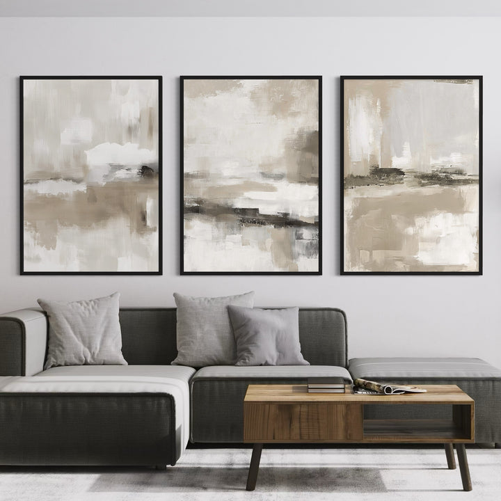 Set of 3 Neutral Framed Canvas Abstract Wall Art Prints in Modern Living Room with Grey Sectional Sofa, Wood Coffee Table, and Soft Throw Pillows