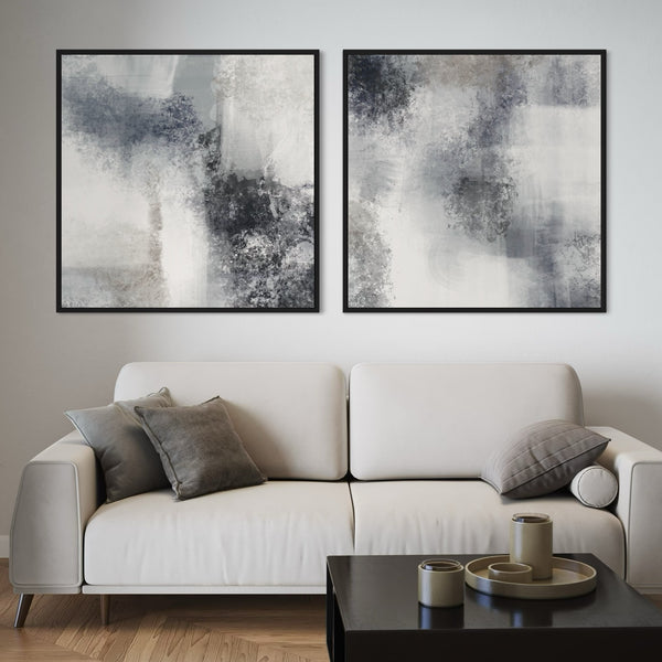 Abstract Canvas Wall Art With a Beige Sofa With Grey Cushions in a Modern Minimalist Living Room With a Black Coffee Table.