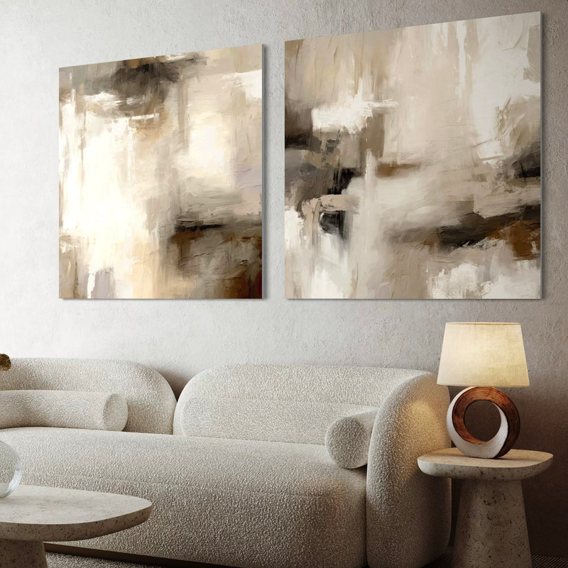 Neutral Abstract Canvas Wall Art With a Curved White Boucle Sofa in a Modern Minimalist Living Space With a Round Stone Coffee Table and Elegant Circular Lamp