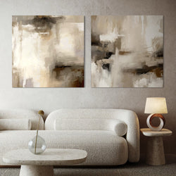 Neutral Abstract Canvas Wall Art With a Curved White Boucle Sofa in a Modern Minimalist Living Space With a Round Stone Coffee Table and Elegant Circular Lamp