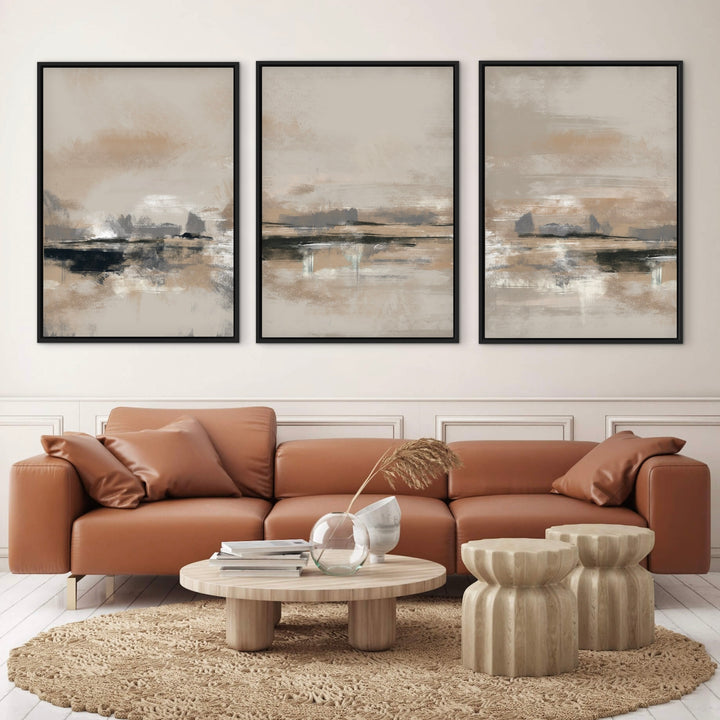 Rome set of three framed canvases above a tan leather sofa