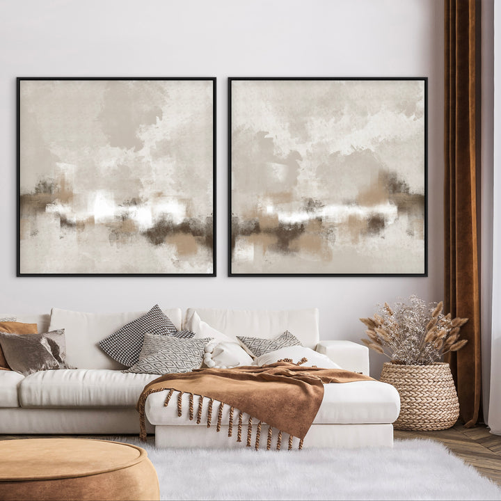 Sorrento set of two neutral abstract framed canvases above a white sofa with a brown throw