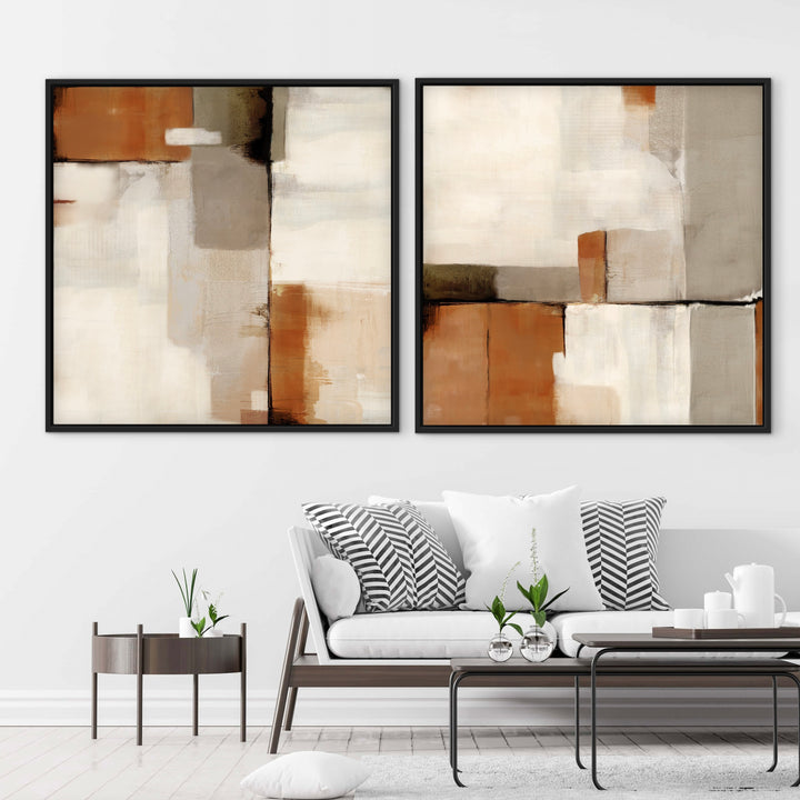Sahara terracotta and beige abstract framed canvases above a modern white sofa