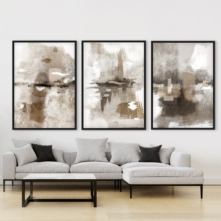 Portofino set of three neutral abstract framed canvases above a cream sectional sofa