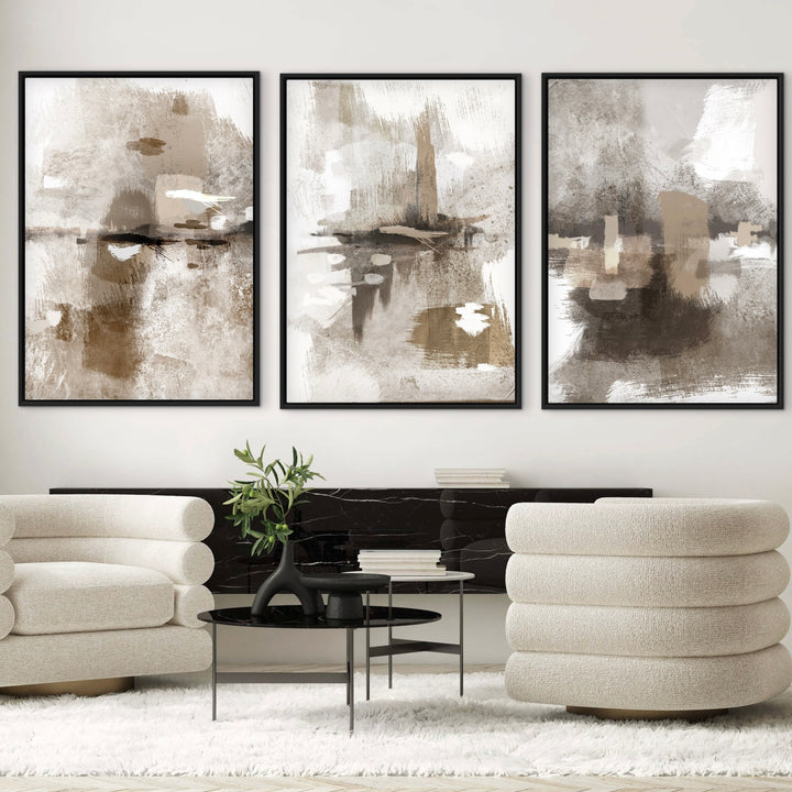 Portofino beige and taupe abstract triptych above sculptural cream armchairs
