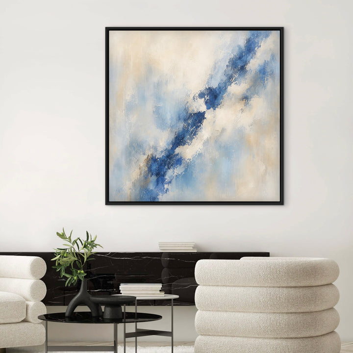 Lazuli textured blue abstract framed canvas between cream lounge chairs