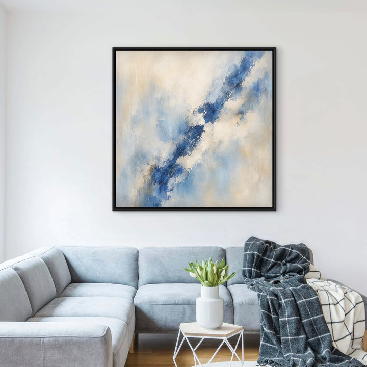 Lazuli blue abstract framed canvas above a pale blue sectional sofa