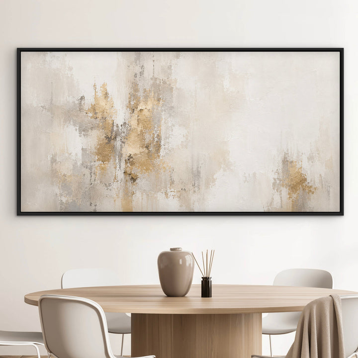 Gilded Silence ivory and taupe panoramic framed canvas above a light grey sofa