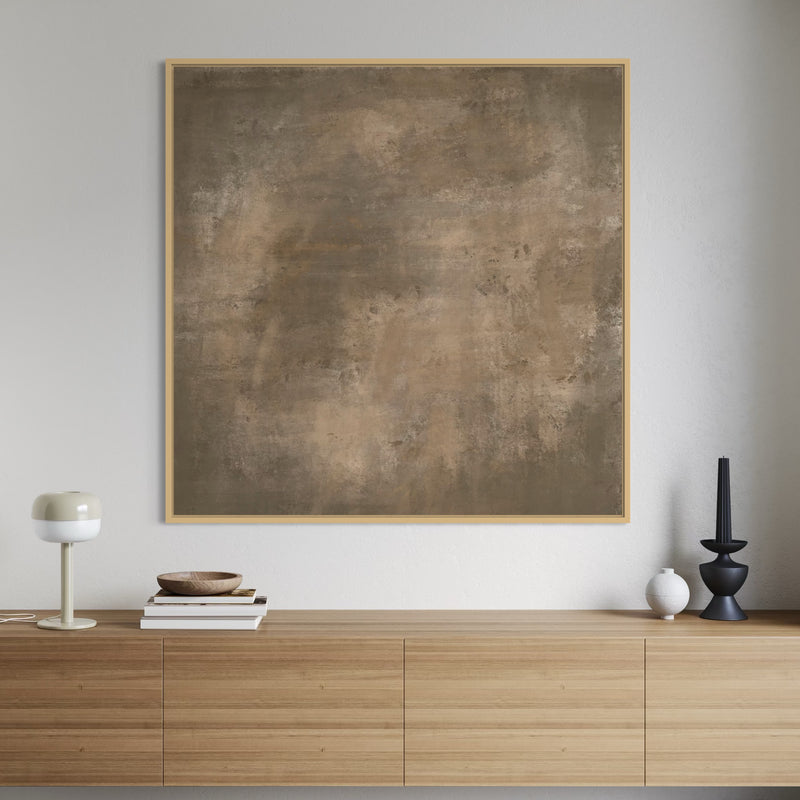 Abstract painting on a wall above a wooden cabinet with decorative items.