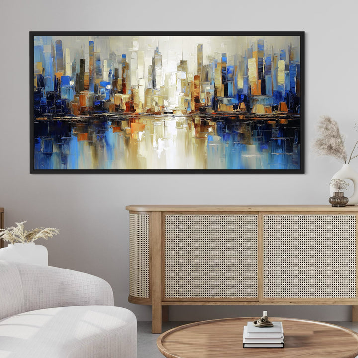 Modern Cityscape Abstract Canvas Wall Art – Vibrant Skyline Painting Styled with a Minimalist Rattan Sideboard, White Curved Sofa, Round Wooden Coffee Table, and Neutral Décor Accents for a Contemporary Living Room
