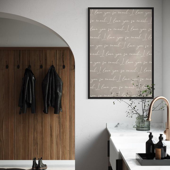 Taupe Love-Quote Canvas—“I love you so much”—Styled With an Arched Wood Wall, Marble Counter, and Brass Faucet For a Chic Modern Entry or Kitchen.