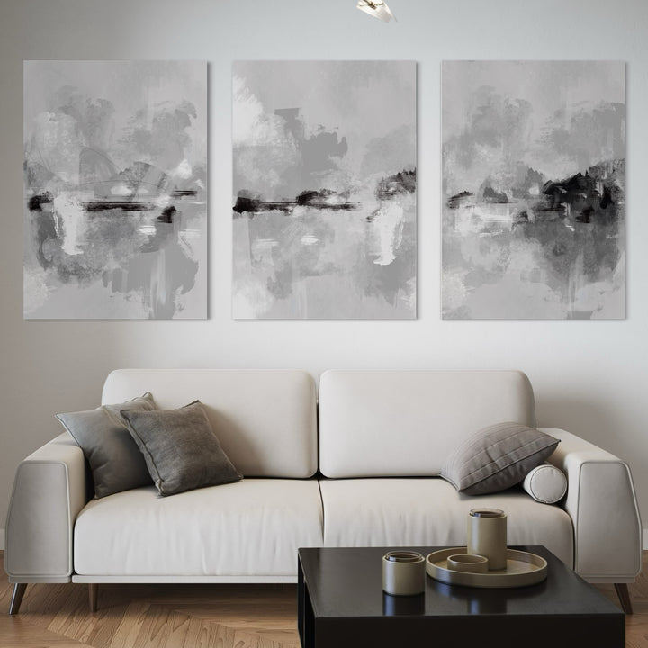 Abstract Canvas Wall Art – Modern Greyscale Triptych for Living Room or Office Styled with Minimalist Ivory Sofa and Black Minimalist Coffee Table with Decorative Accent