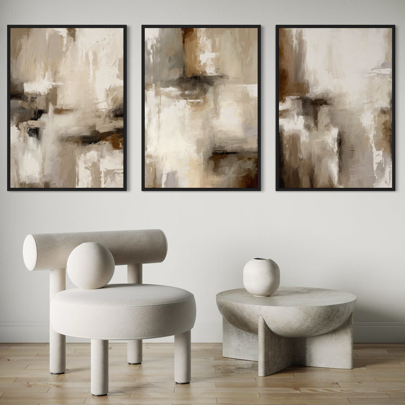 Warm Greige And Taupe Abstract Triptych Wall Art- Paired With A Sculptural Bouclé Lounge Chair And Carved Stone Pedestal Table On Light Oak Floors For A Calm, Minimalist Vignette.