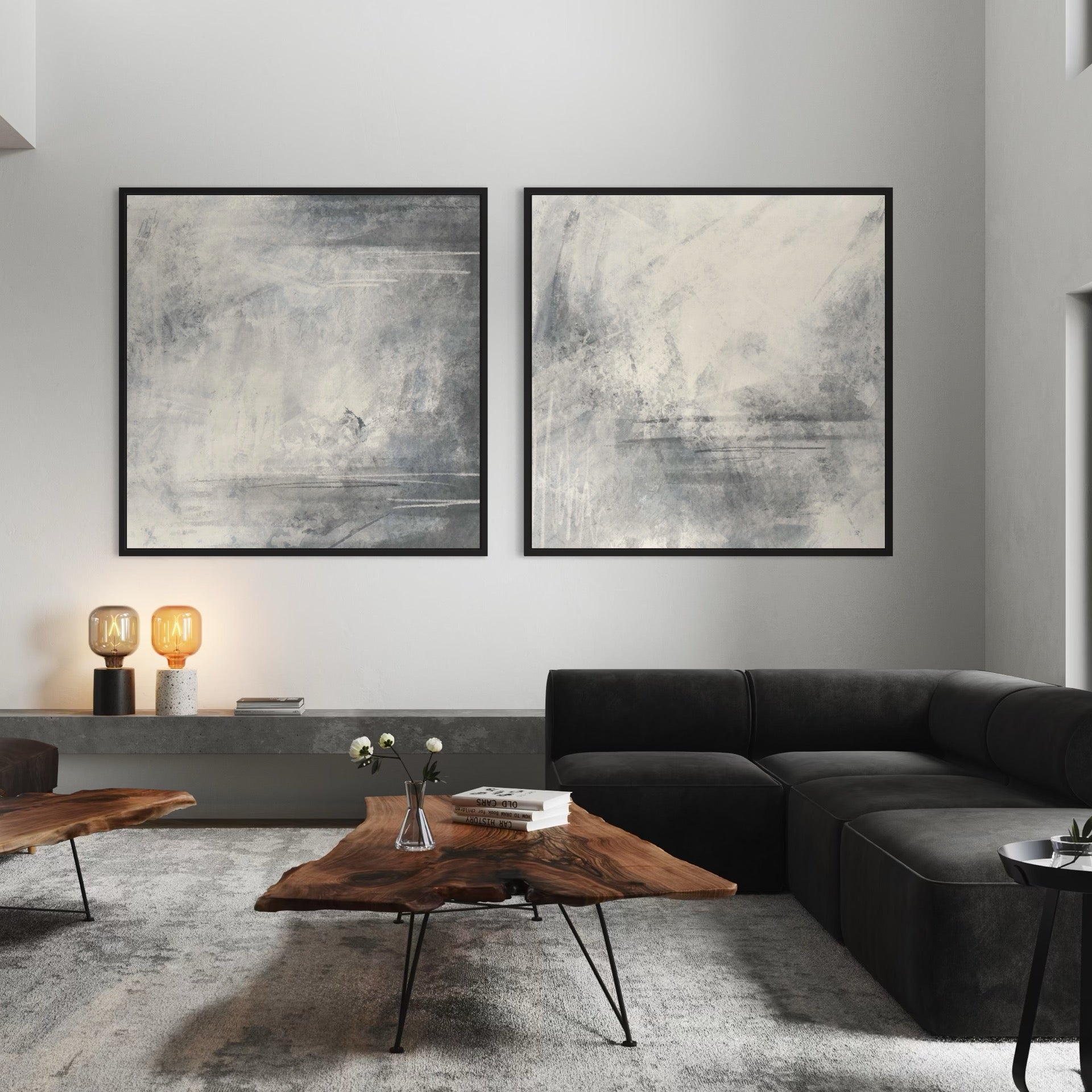 Blue-Grey Abstract Diptych Above a Black Sectional with Live-Edge Tables and Amber Lamps—Serene Modern Wall Art to Elevate a Minimalist Living room.