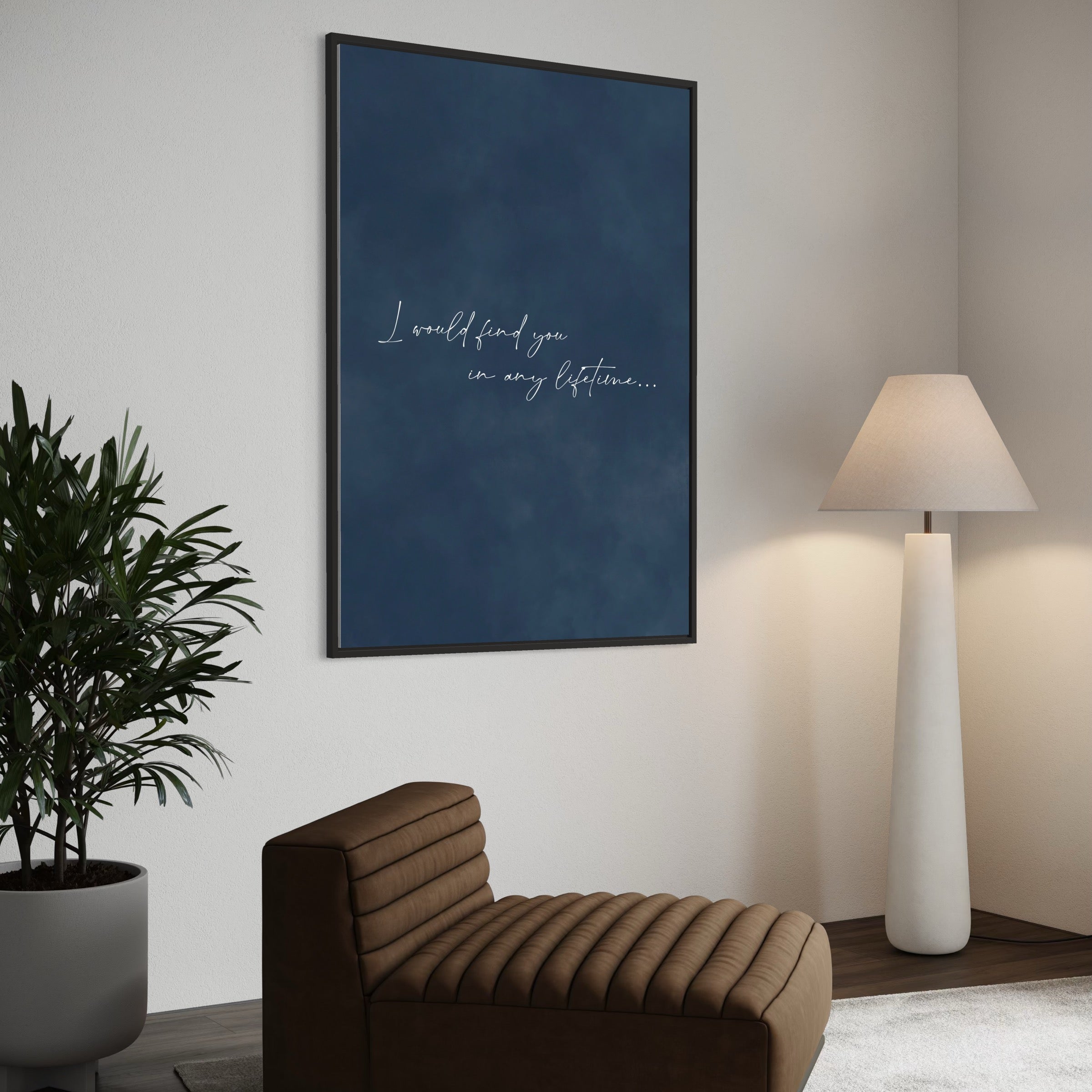 Navy Quote Canvas—“I would find you in any lifetime…”—Styled With Brown Lounge Chairs, a White Floor Lamp, and Greenery For a Cozy Modern Living Room.