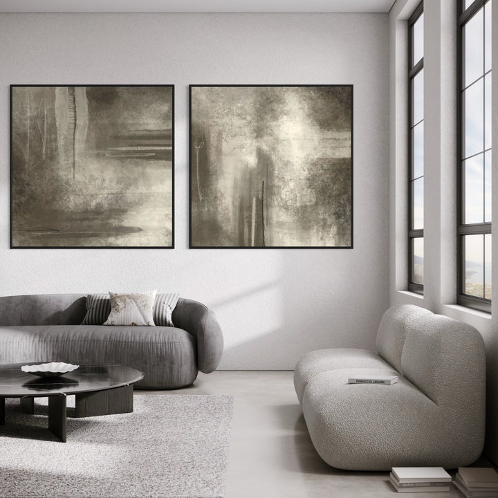 Neutral Abstract Diptych Above Grey Velvet and Boucle Sofas With a Black Round Table—Serene Greige Wall Art to Elevate a Modern Living Room.