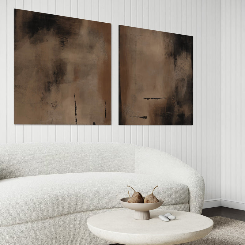 Set of Two Modern Abstract Canvas Wall Art Prints With White Boucle Sofa and Round Stone Coffee Table with Minimal Decor in Elegant Living Room.