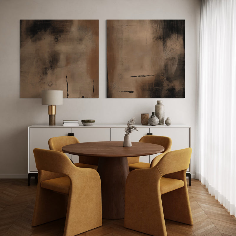 Set of Two Modern Abstract Canvas Wall Art Prints Above White Sideboard in Elegant Dining Room with Mustard Upholstered Chairs and Round Wood Table.