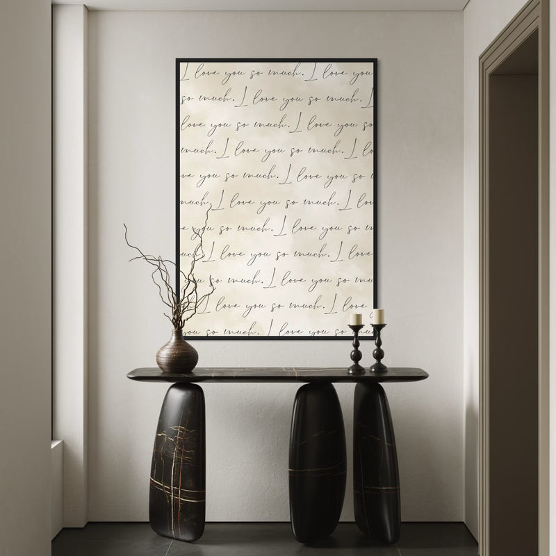 Cream Love-Quote Canvas Above a Sculptural Black Marble Console With Branches and Candlesticks, Elevate Your Entryway with Minimalist, Modern Wall Art.