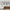 Elegant Framed Abstract Art Wall Decor – Displayed Above a Modern Wooden Sideboard with Brass Accents, and Sculptural Decorative Vases –  Sophisticated Living Spaces