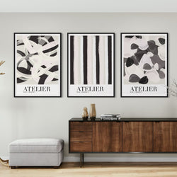Elegant Framed Abstract Art Wall Decor – Displayed Above a Modern Wooden Sideboard with Brass Accents, and Sculptural Decorative Vases –  Sophisticated Living Spaces