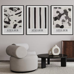 Elegant Abstract Framed Wall Art – Contemporary Living Space with Sculptural Round Lounge Chair, Minimalist Black Coffee Table, and Organic Ceramic Decor – A Perfect Blend of Modern Art and Interior Sophistication