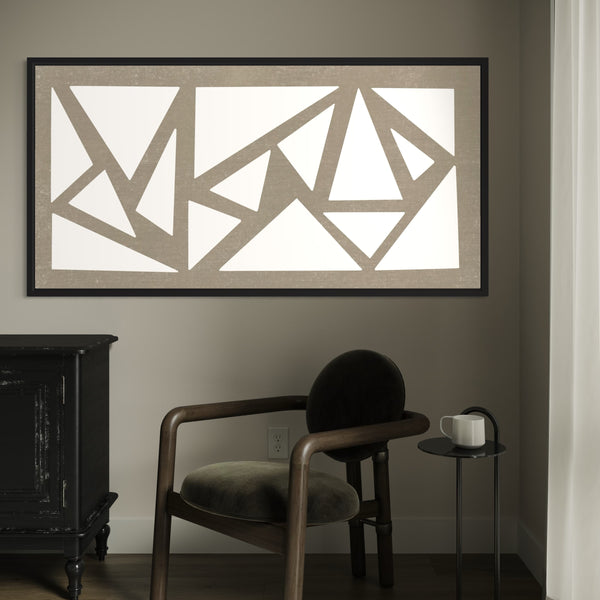 Stylish Abstract Art Framed Canvas Displayed in The Corner Paired with a Vintage-Style Armchair, a small Steel Coffee Table and a Console Table