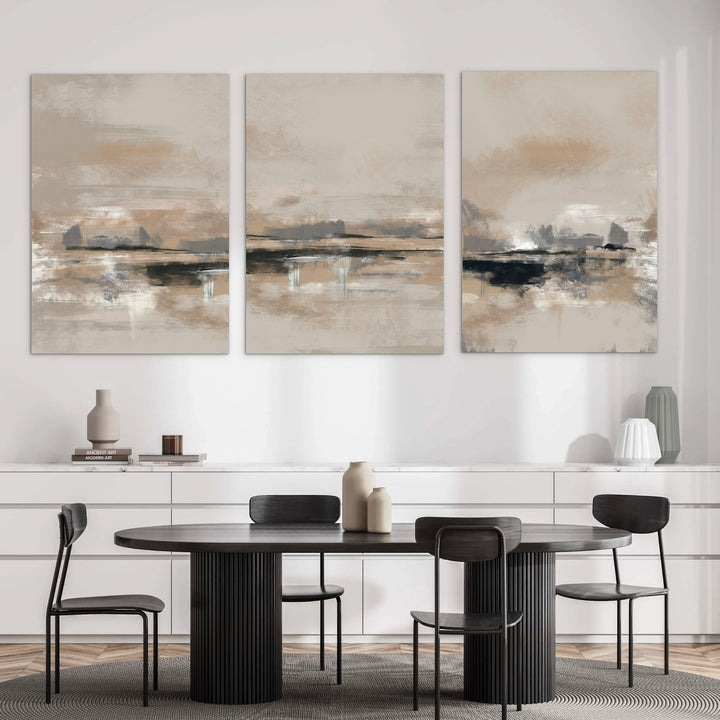 Modern Abstract Canvas Triptych Styled with a Black Pedestal Dining Table, Black Dining Chairs, a White Sideboard, and Neutral Ceramic Vases. Perfect for a Minimalist Dining Room.