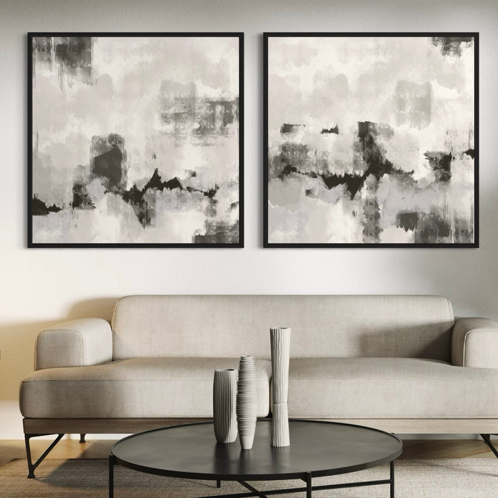 Modern Abstract Art Framed Canvas Styled with a Light Beige Sofa, Black Round Coffee Table, and Sculptural Ribbed Ceramic Vases. Perfect for a Minimalist Living Room.
