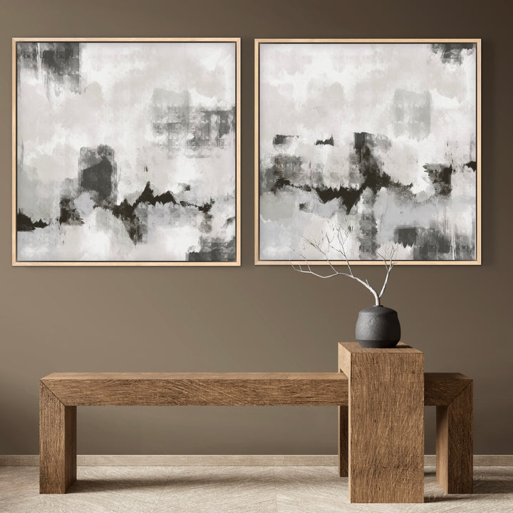 Modern Abstract Art Framed Canvas Triptych Styled with a Solid Wood Minimalist Bench, a Charcoal Ceramic Vase with Branches, and a Warm Taupe Wall. Perfect for a Minimalist Entryway.