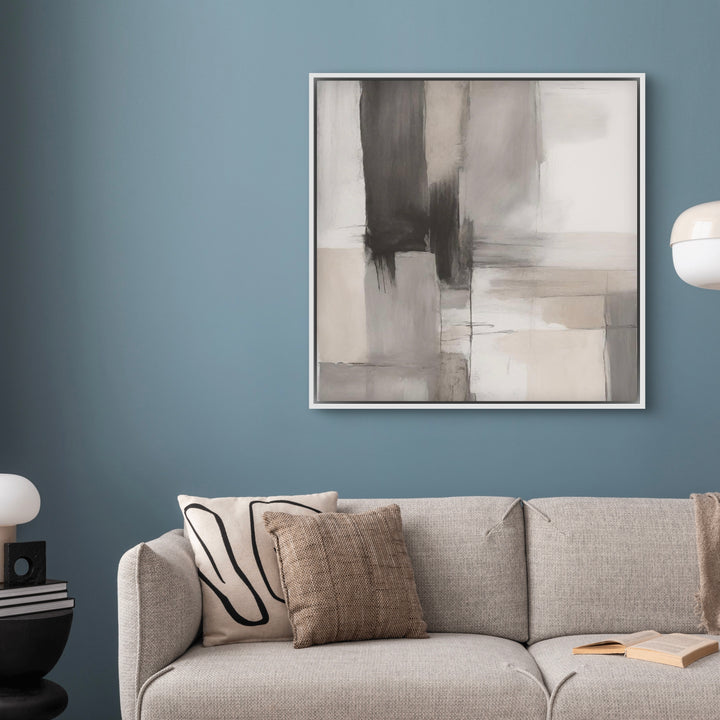 Modern Abstract  Framed Canvas Styled with a Grey Textured Sofa, Blue-Grey Wall, Black Side Table with  White Lamp, and Neutral Throw Pillows. Perfect for a Minimalist Living Room.