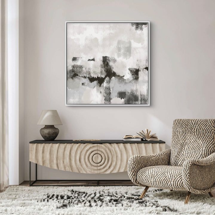 Modern Abstract Art Framed Canvas Styled with a Sculpted Wood Console Sideboard, Textured Stone Table Lamp, and a Patterned Accent Chair on a Plush Shag Rug. Perfect for a Minimalist Living Room.